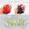 Arte de uñas flor de cinco pétalos joyería flor blanca pequeña bolsa mixta de tamaño de cuentas doradas y plateadas decoración de pegatina de uña de flor de resina venta al por mayor