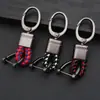 Chaveiro de carro de corda de couro trançado novo do fabricante, simples para homens, liga de zinco, padrão de pendurar na cintura, fivela de cabeça grande, cordão