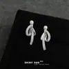 Pendientes de borla con lazo incrustado de circonita, a la moda y sofisticados, estilo dulce y fresco único, nueva cadena de suministro de pendientes de fábrica