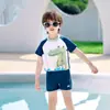 Traje de baño para niños Warrior 2025 Nuevo Modelo de una pieza con capucha y mangas largas para niños pequeños Traje de baño de secado rápido Venta al por mayor