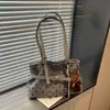 Bolsa de ombro Ruien estilo coreano popular de bolinhas 2026 nova moda bolsa de mão listrada simples casual bolsa de ombro