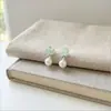 Pendientes de botón de cristal verde menta, grava, perla y estrella de mar 2026 Verano Frescos Dulces Pendientes Diseño Nicho Joyería para Orejas