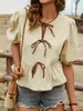 Ropa nueva para mujer de estilo fresco y dulce transfronteriza: blusa de manga abullonada con corbata de moño y dobladillo fruncido que ciñe la cintura de manga corta