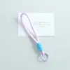 Nuevo cordón para teléfono anudado de bloques de color, llavero DIY hecho a mano, accesorio para bolso, colgante de regalo pequeño, venta al por mayor