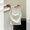 Camisola blanca única y hermosa sin mangas y con cuello redondo para mujer, adecuada para el verano, corte ajustado, versátil, estilo corto con un hermoso diseño en la espalda