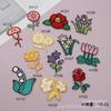 Calcomanías de tela bordadas flores exquisitas bordadas autoadhesivas sin costura fabricantes de origen parche insignia en stock accesorios de ropa