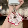 Alça de celular em tecido estilo doce e feminino com enfeites de strass, design criativo, atacado para chaveiros e pingentes de bolsa