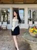 Camisa de un hombro suave estilo francés Ls para mujer Guangzhou Shisanxing Primavera 2026 Nuevo Top para mujer 22977