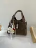 Bolsa de Mão Feminina Estilo Cesta de Design Exclusivo com Toque de Luxo, Bolsa de Ombro, Bolsa Transversal Tipo Balde, Novo Modelo Versátil Outono/Inverno 2025