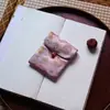 Muestra de pedido final se puede pedir bolsa de tela de brocado para regalo bolsa Wenwan estilo japonés bolsa de almacenamiento de joyas billetera plegable tela