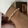 Suministro transfronterizo exclusivo de nuevos brazaletes vintage de aleación floral con goteo de aceite, joyería versátil de esmalte ovalado, venta directa del fabricante