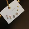 Pendientes pequeños de una semana, populares pendientes pequeños de aguja de plata S925, una tarjeta, tres pares de pendientes de combinación de traje, pendientes de circonita roja de red para mujer
