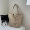 Bolsa de Lona de Gran Capacidad para Mujer 2025 Nueva Bolsa de Hombro Tipo Tote Coreana Ins Bolsa para Estudiantes Clase Viajero