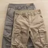 Calça de trabalho casual versátil slim fit cropped masculina nova tendência vintage estilo japonês para primavera e outono, slim reta, multi-bolsos