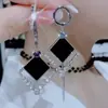 Pendientes elegantes de alta gama con borlas de diamantes negros, diseño asimétrico geométrico largo y elegante, pendientes de moda con un efecto adelgazante exagerado.