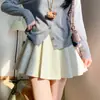 Saia Plissada de Cashmere Azul Marinho para Mulheres Primavera e Outono 2025 Nova Cintura Alta Estilo Menina Preppy Corte Evasê Saia Anti-Exposição