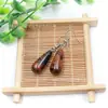 Venta al por mayor de fábrica aretes largos de cristal natural forma de gota de agua amatista Ojo de Tigre Joyería con gancho para la oreja aretes redondos de gota de agua DIY