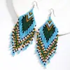 Pendientes de Borla Larga Coloridos con Flores de Luna de Cuentas de Arroz Hechos a Mano de Venta Caliente Transfronteriza Gancho de Oreja Bohemio Europeo y Americano para Mujeres