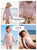 Traje de baño para bebé 2026 nuevo modelo estilo ins manga larga secado rápido poliéster traje de baño infantil para vacaciones conjunto de dos piezas para niñas
