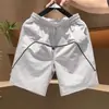 Nuevos shorts deportivos ligeros de secado rápido para hombre de verano, modernos, a la moda, holgados, versátiles, casuales, transpirables, shorts negros