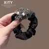 Nuevo pasador de pelo de cristal de estilo coreano y japonés de lujo ligero para mujer, scrunchie de satén negro, accesorio de coleta lujoso y elegante