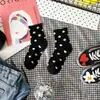 Calcetines de lunares dulces nuevos de otoño e invierno calcetines de lunares para niños estilo académico caricatura japonesa y coreana fabricantes de Liaoyuan al por mayor