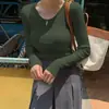 Camiseta redonda popular europea y americana para mujer, top casual de alta gama, color liso, diseño acanalado elástico, camiseta de manga larga para usar por fuera