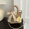 Bolsas tejidas hechas a mano de verano para mujer 2026 Nueva moda Bolso cruzado de paja para mujer Vacaciones en la playa Bolso cubo portátil