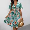 Nueva colección transfronteriza europea y americana 2025: Vestido de verano para mujer, con escote en V, estampado floral, estilo vacacional a la moda, hasta la rodilla