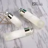 Cosméticos de alto valor de cor Conjunto Xinyue frasco 30g frasco de creme 100ml creme aquoso essência de creme frasco de vidro fundo grosso