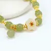 Paso a paso imitación de flor jade Hetian pequeño colgante pulsera de orquídea de lujo ligero diseño de nicho de lujo regalo para novia
