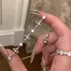 Pulsera de Cruz Iris Estilo Frío Ins para Mujer Lujo Ligero Diseño de Nicho Avanzado Ajustable Accesorios de Mano Apilables