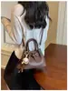 2026 Inverno Nova Bolsa Casual de Alta Qualidade Moda Personalidade Única Ombro Cruzado Tendência Simples Bolsa de Balde Feminina