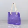 Bolsa de mano láser de PVC celebridad de internet color deslumbrante bolsa de regalo tienda de ropa de exposición alto valor estético bolsa de mano láser de compras