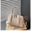 Bolso tipo concha casual y elegante de diseño único, nuevo modelo primavera 2026, bolso de hombro y cruzado simple de moda para mujer