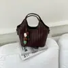 Bolso de tejido de alta gama de nicho para mujer, nuevo bolso cruzado versátil de moda 2026, bolso de mano exquisito, bolso tipo cubo