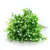 Atacado Yiwu flor artificial planta verde pequeno arranjo de flores em vaso decoração de casamento flor falsa de plástico mini única grão de Milão