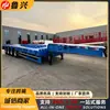 Semirremolque de plataforma baja de cuatro ejes para exportación a África, semirremolque de transporte de maquinaria con cuello de cisne de doble sección y rampa hidráulica