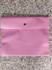 En stock bolsa gruesa para ropa con hebilla oculta bolsa de embalaje no tejida bolsa de embalaje con hebilla oculta bolsa para ropa con botón de alta gama bolsa de protección ambiental