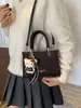 Bolsa quadrada pequena minimalista da moda transfronteiriça para mulheres, nova bolsa de ombro 2026, bolsa transversal versátil para o dia a dia, estilo popular