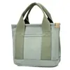 Nova bolsa de lona estilo japonês muito estilosa, moderna e simples, bolsa tote de grande capacidade, adequada para o trajeto diário, bolsa de almoço multiuso para mulheres