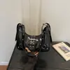 Bolsa de motocicleta feminina 2026 nova moda bolsa bolinho versátil bolsa de axila bolsa de trajeto bolsa crescente bolsa de ombro transversal texturizada