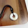 Pie Plata de Ley 999 Oro Pi Xiu Ping An Feliz Hebilla Ping An Colgante para Hombres y Mujeres Nuevo Estilo Chino Estilo Nacional