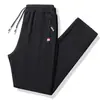 Pantalones Deportivos Nuevos de Primavera y Otoño para Hombre de Moda Casual Versátiles Juventud Estudiante Talla Grande Pantalones Sanitarios