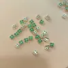 Nuevo arte de uñas transfronterizo color circón trébol de cuatro hojas joyería de circón de lujo japonesa flor accesorios para uñas diamante al por mayor