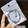Libro Caperucita Roja Mismo Estilo Estudiante Pulsera de Glaseado de Palomitas de Maíz Hecha a Mano con Cuentas Dibujos Animados Cristal Pulsera Infantil Venta al por Mayor Cajas de Regalo