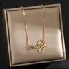 Europa y Estados Unidos transfronterizo súper ventas collar de cuerpo completo de acero de titanio para mujer sensación de alta calidad temperamento chapado 18K cadena de clavícula joyería no se decolora