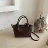 Bolso de mujer de alta gama 2026 nuevo otoño super popular bolso de mano pequeño para el trabajo y uso diario, bolso cubo bandolera y de hombro para commuters
