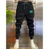 Pantalones deportivos casuales ajustados para hombre, versátiles y de moda, primavera 2023, marca popular, ajuste slim, con cordón en el tobillo