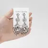Pendientes Amazon transfronterizos, extragrandes, electrochapados, elegantes, de estilo largo, con un toque de alta gama, adornados con borlas y pedrería negra